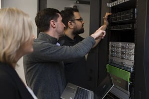 Three Burwood employees working on server Three Burwood employees working on server