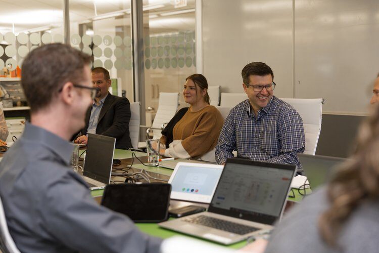 Meeting in conference room with 5 Burwood employees